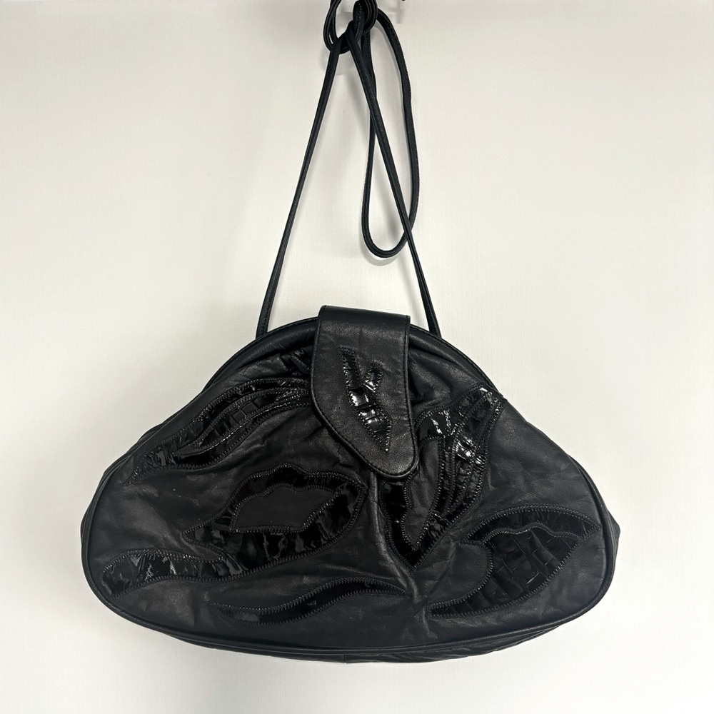 Vintage unique black leather shoulder bag with tension closure